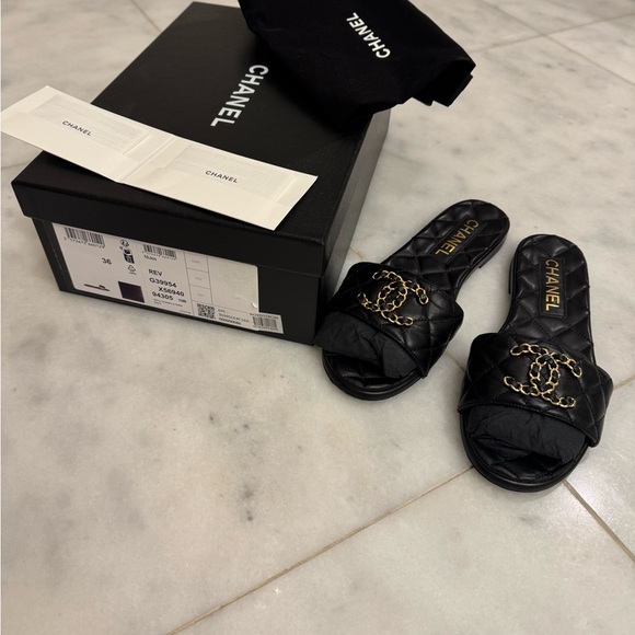 CHANEL Shoes - CHANEL Black Quilted Slide Sandals with Gold Accent